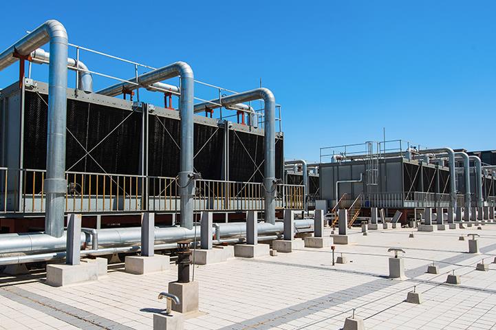 set of cooling towers on commercial building