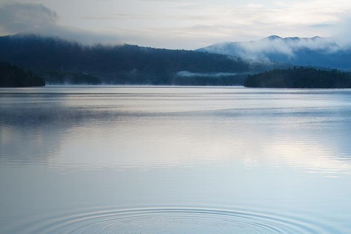 Ocean water with mountains in the distance