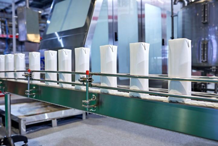 paper containers on an assembly line