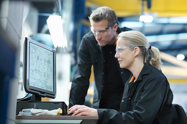 two engineers using computer